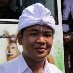 Een Balinese jongen met een udeng